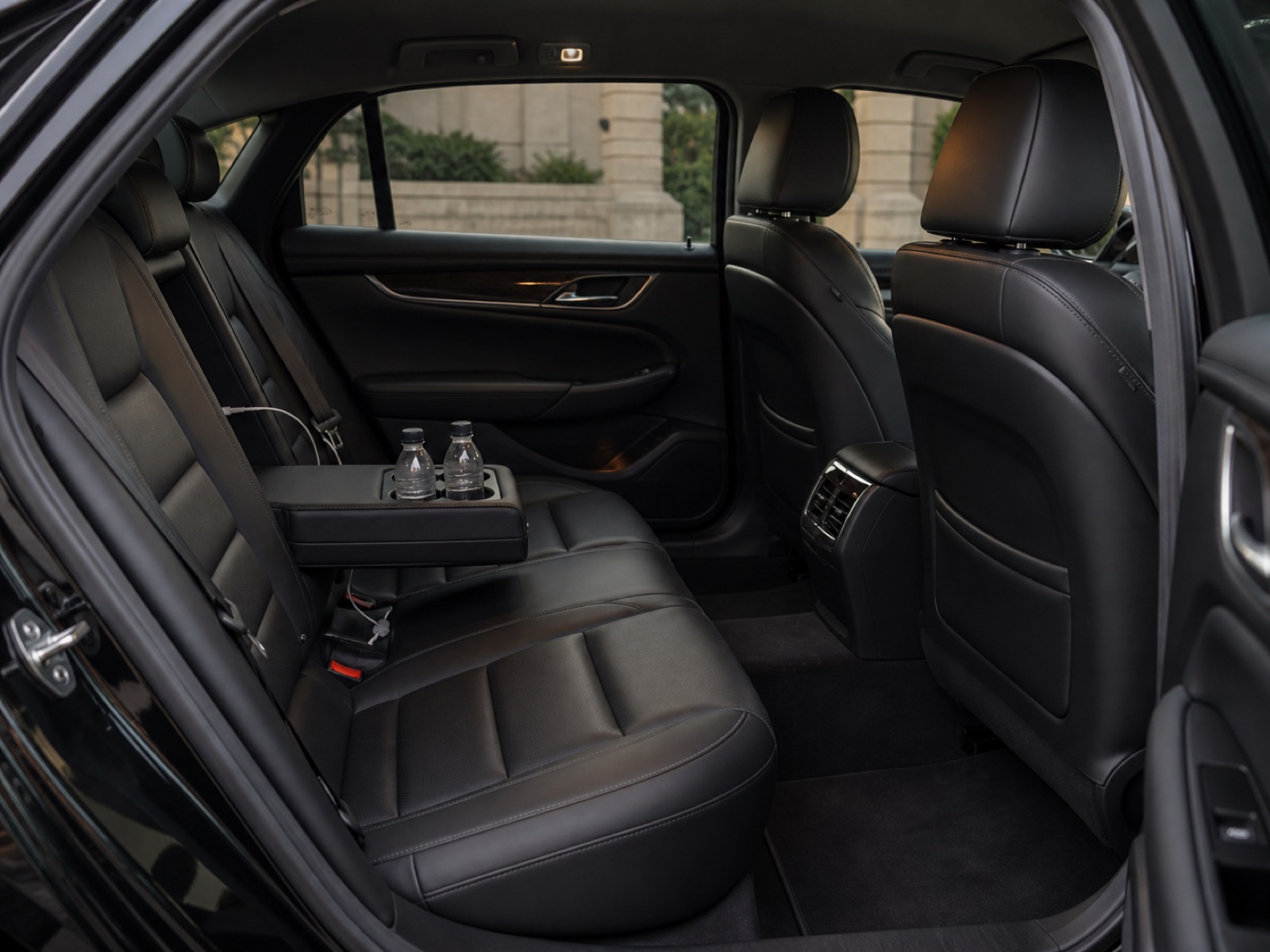Black leather rear cabin inside a Cadillac XTS luxury sedan